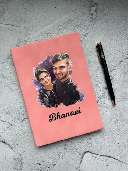 This gift set features a diary with a custom artistic portrait printed on the cover, paired with a personalized pen and a name-engraved MDF Rakhi.