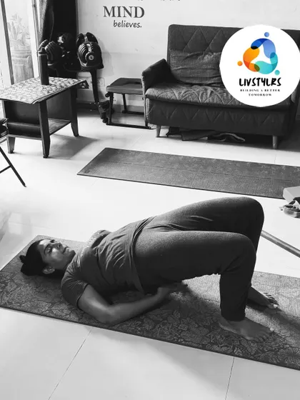 A client performs a bridge pose, a simple but effective exercise for strengthening the glutes, hamstrings, and lower back.