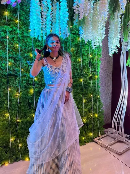 This client is twirling in her striped ready-to-wear saree, showing how comfortable and easy to manage my rental sarees are, even on the dance floor.