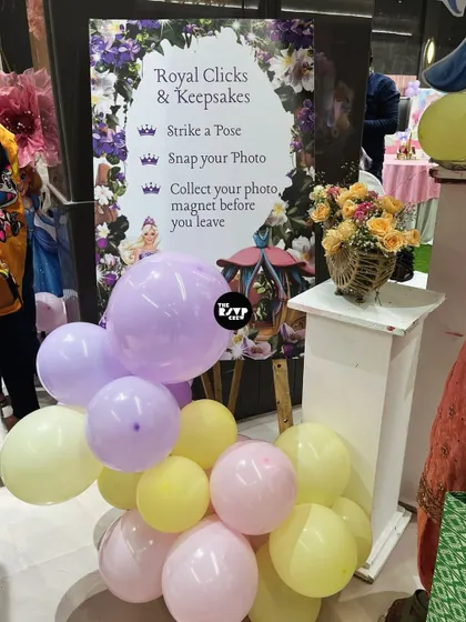 An interactive 'Royal Clicks & Keepsakes' station where guests could strike a pose and get a photo magnet as a souvenir.