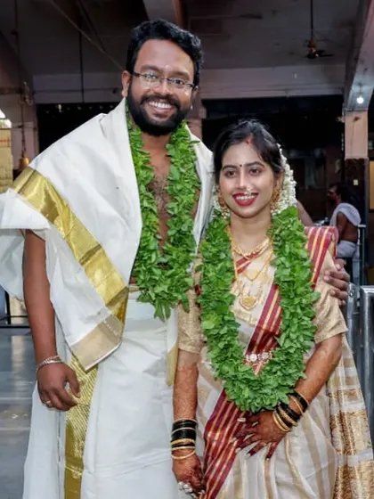 A beautiful couple at their Kerala wedding ceremony. The bride's saree is draped to be both traditional and comfortable, allowing her to move easily through the temple rituals.