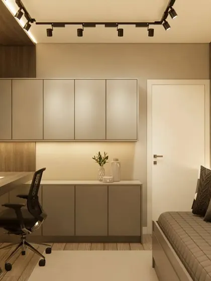 A view of the home office showing the seamless integration of the desk with the storage cabinets and a small daybed.