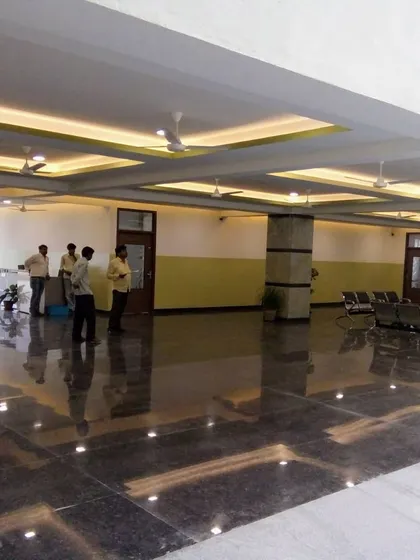 A wide shot of the reflective flooring and ceiling design in the main hall of Asia Pacific World School.
