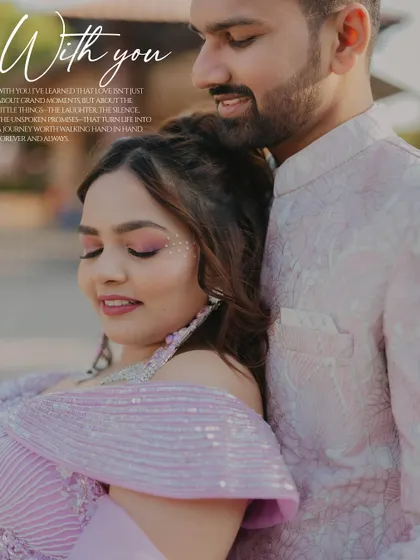A tender moment between the couple during their wedding carnival. The groom's gentle kiss on the forehead is a perfect expression of love and affection.