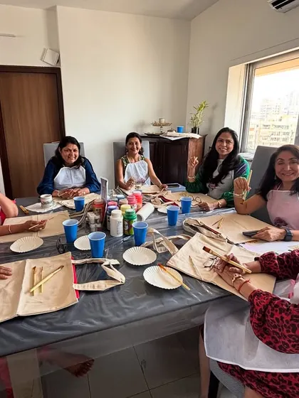 The setup for a private tote bag painting session. We bring everything you need to turn your home into an art studio.