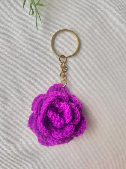 This vibrant purple rose keychain is sure to brighten up your day every time you reach for your keys.
