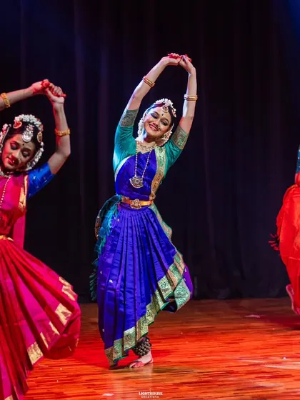 Three dancers in perfect harmony, their movements flowing together as one. This is a testament to their teamwork and countless hours of rehearsal for Margam.
