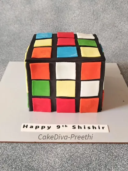 The Rubik's Cube cake, a perfect centerpiece for a puzzle lover's birthday. It's as fun to look at as it is delicious to eat.