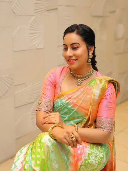 A final, beautiful portrait of Dr. Shruthi, her radiant smile the perfect accessory for this stunning saree.