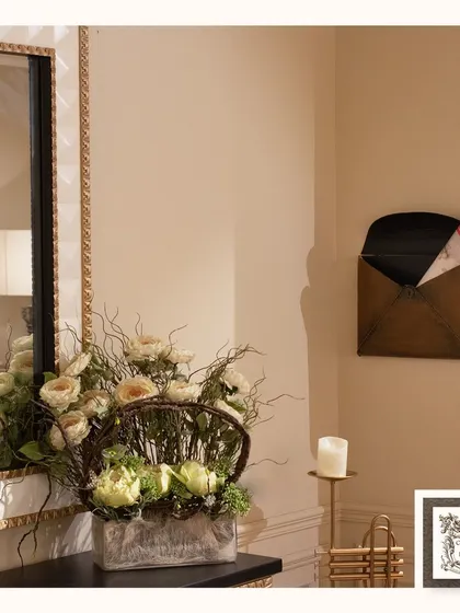 This vintage-style metal mailbox is a unique and charming piece of wall decor. It adds a touch of nostalgia and rustic character to an entryway or hallway.