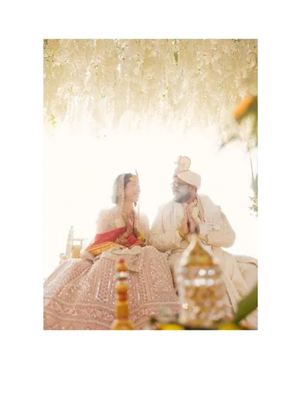 A serene and beautiful portrait of the couple during their wedding ceremony. The soft, bright light gives the image an ethereal and timeless quality.