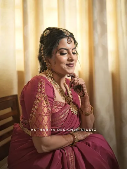 A lovely portrait of Anupa, showcasing her elegant engagement look and the intricate work on her blouse.