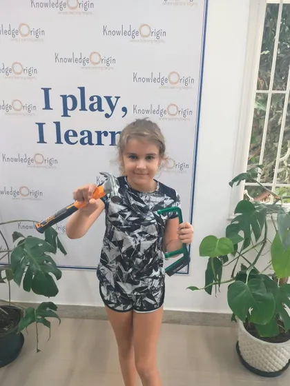 With a hammer and saw in hand, this camper is ready for our STEM workshop. These activities are designed to be engaging and educational, teaching practical skills through fun projects.
