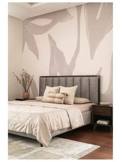 This wider shot of the master bedroom shows the full effect of the custom wallpaper, creating a sophisticated and artistic focal point behind the bed.