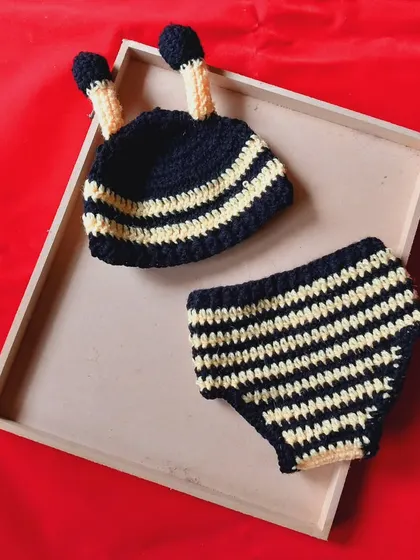 This is the baby boy version of my popular bumblebee outfit. It includes the striped beanie with antennae and a simple, comfortable striped diaper cover. It’s a perfect handmade costume for a "sweet as can bee" photoshoot.