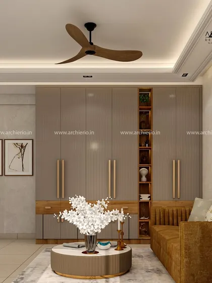 This large wardrobe unit in a neutral taupe finish includes open wooden shelves for display, breaking the monotony and adding warmth.