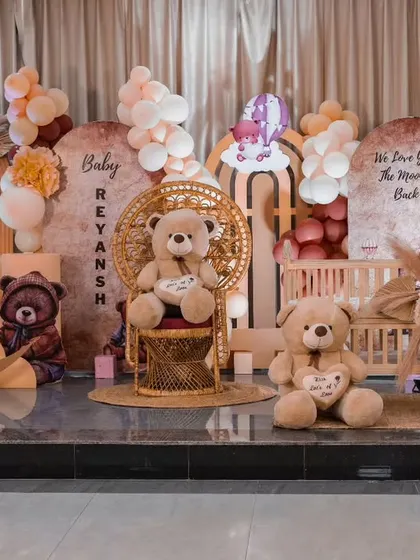 The full view of the grand teddy bear themed ceremony, showcasing the multiple backdrops, crescent moon, and the entire family of teddy bears celebrating baby Reyansh.