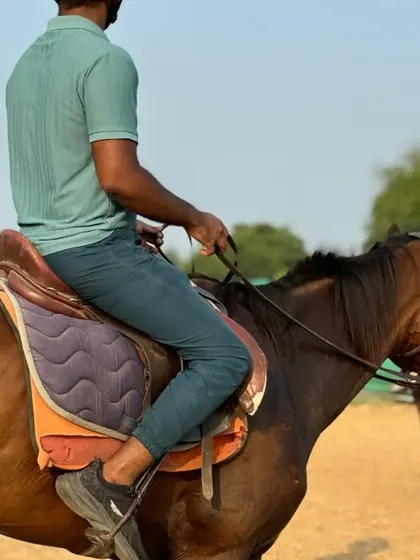 A view from behind a rider, showing the focus and control required for a successful ride.