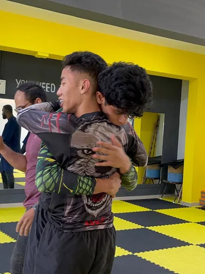 This is what teamwork looks like. Two teammates who just had an awesome fight, showing respect and brotherhood after the match.
