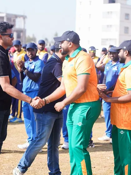 Another angle of the sportsmanship handshake between opposing teams.