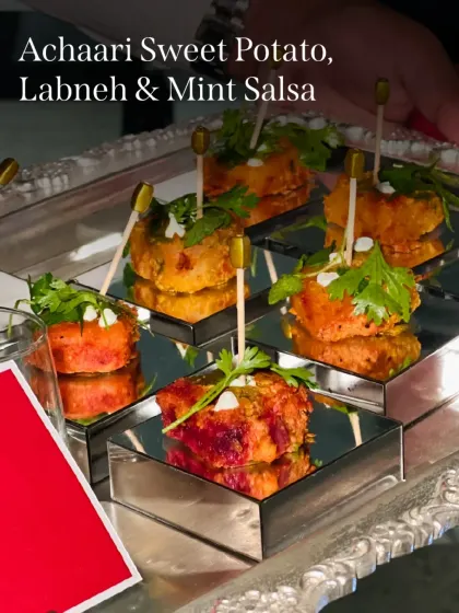 Achaari Sweet Potato bites with cool labneh and mint salsa. The pickled spice of the sweet potato is perfectly balanced by the creamy yogurt.