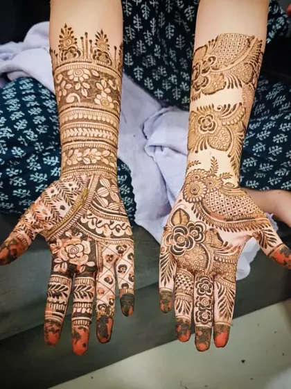 A unique design that combines a traditional floral cuff on one hand with a modern Arabic-style trail on the other.