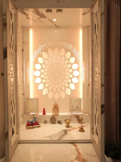 An open view of the marble-finish mandir, showing the backlit jaali and the spacious platform for placing idols and pooja essentials.