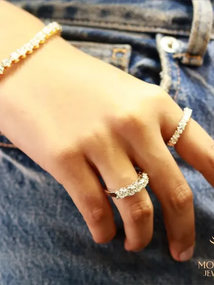 A casual yet chic look, pairing classic diamond eternity rings and a tennis bracelet with denim. This shows the versatility of my designs, perfect for both glamour and everyday elegance.