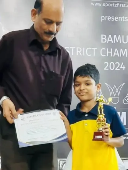Rhys receiving his trophy and certificate at the BAMU District Championship award ceremony.