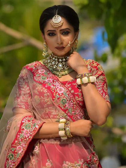 A powerful and direct pose, showcasing the confidence that comes with feeling your best. The kohl-rimmed eyes and flawless base create a look that is both strong and traditionally beautiful.