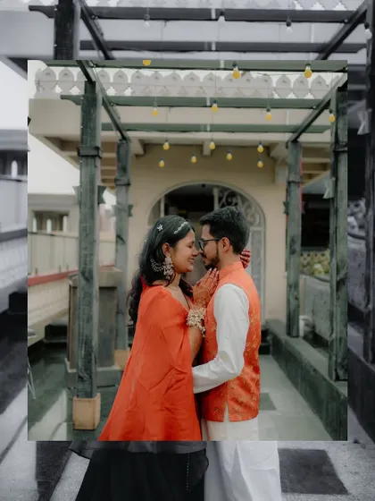 A creative, framed shot of Sugandha and Ashish sharing an intimate moment. This photo showcases my eye for unique compositions that tell a romantic story.
