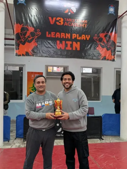 Presenting an award at our 2nd V3 Open Corporate Table Tennis Tournament. These events are a huge success, bringing together professionals for a day of competition.