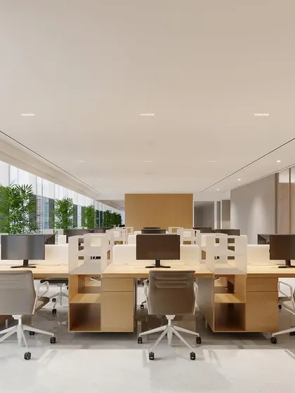 A rendering of a bright, open-plan workstation area in a vertical campus. The design uses light wood tones and clean lines to create a calm and focused environment, with ample natural light from the large windows.