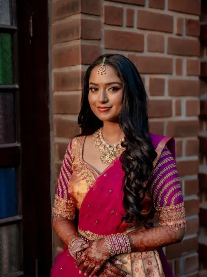 A lovely portrait of the bride, with the rich color of her henna adding to her traditional look.
