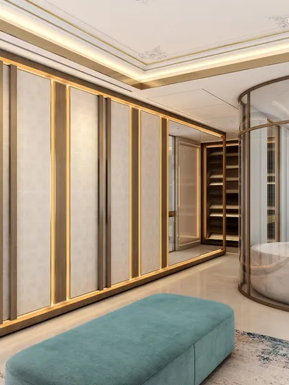This palatial bathroom, part of a 2,000 sq. ft. master suite, features a large walk-in closet and a freestanding circular tub enclosed in glass. The design uses palatial stones and a modern twist on textures to create a truly regal experience.