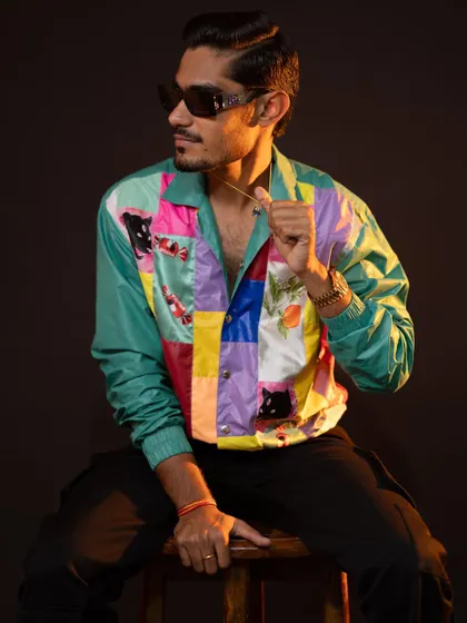It was super fun styling YouTuber Amit Sharma, "The Indian Unboxer." We created a range of cool, casual looks, including this one with a vibrant patchwork jacket, reflecting his energetic personality.
