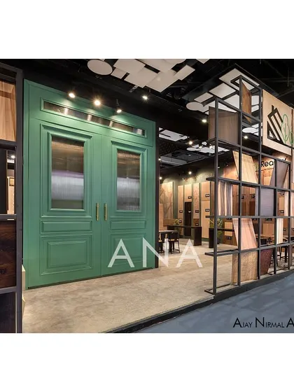 This shot highlights the contrast between the raw, industrial grid displaying veneer sheets and the refined, classic green door. This juxtaposition was a key part of the design concept for the Realply '23 experience zone.