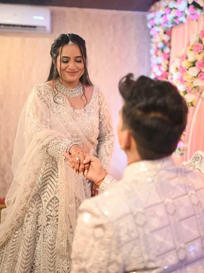 The bride's happy and emotional reaction is the focus here. Her makeup is designed to be tear-proof and long-lasting for all the moments of the day.