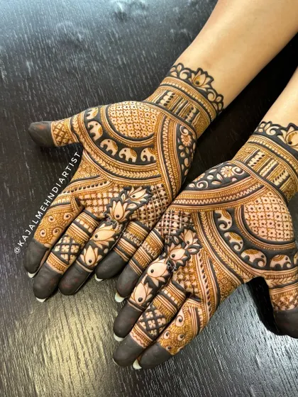 Elephants are a symbol of good luck and prosperity. This design for the groom's sister features a beautiful band of marching elephants, combined with lotus details and full-finger coverage.