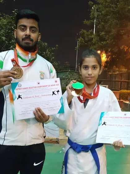Another one of my champions, a young female athlete from the XMA Noida team, holding her gold medal and certificate from the district championship. We train dedicated athletes, regardless of gender.