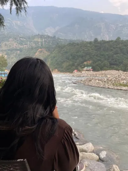 The last weeks of my 20s, reflecting by the river. I didn't just stop carrying my mountains; I befriended them.