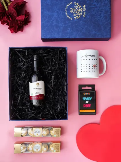 A flat lay of the 'A Toast to Love' hamper, perfect for showcasing the curated items for a romantic celebration.