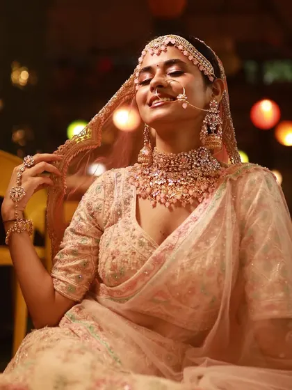 A moment of pure bliss. The bride's makeup is designed to look beautiful and natural, even in candid moments.