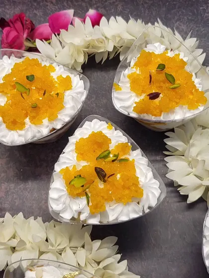 A top view of the Motichoor Tres Leches cups, garnished with pistachios. They are perfect for parties and festive get-togethers.