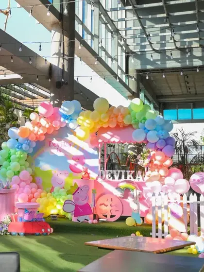 Another perspective of the expansive Peppa Pig party decor, showing the intricate balloon work and themed elements that fill the space.
