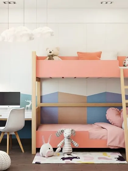 A sweet pink bunk bed with a desk underneath, in a room with a lovely mountain mural.