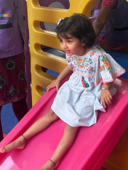 A happy slide down the playground slide. We ensure our youngest learners feel safe and joyful from their very first day.