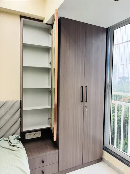 A look inside the slim cabinet next to the dressing mirror, showing how I use every inch of space to create additional shelving.