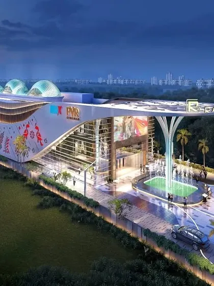 A night render of the Ramindri Walk mall, showing the illuminated facade with its cultural motifs.