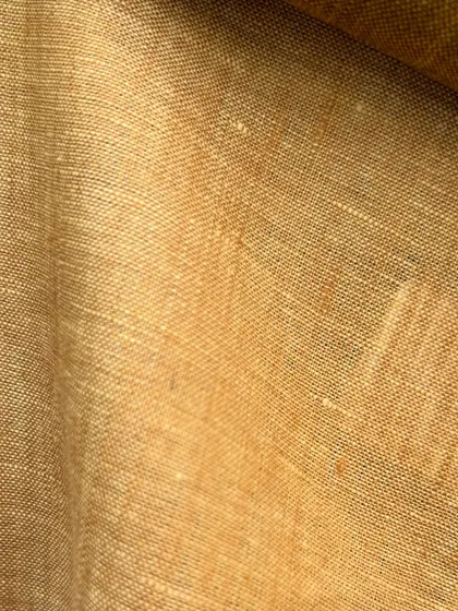A rich, mustard-yellow linen swatch, perfect for a bold and stylish summer statement piece.